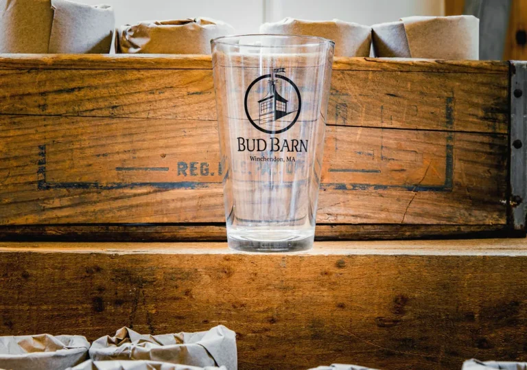 Bud Barn pint glass on a vintage wooden crate